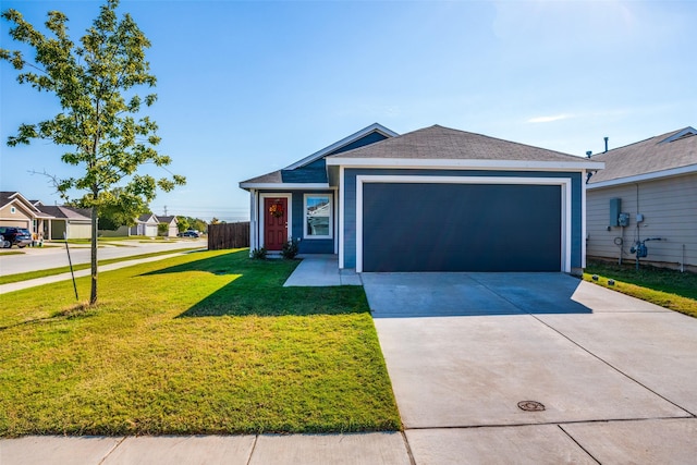 ranch-style home featuring a garage and a front yard