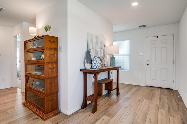 foyer entrance with light wood-type flooring