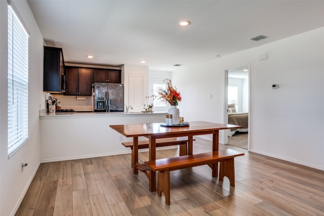 dining space featuring light hardwood / wood-style floors