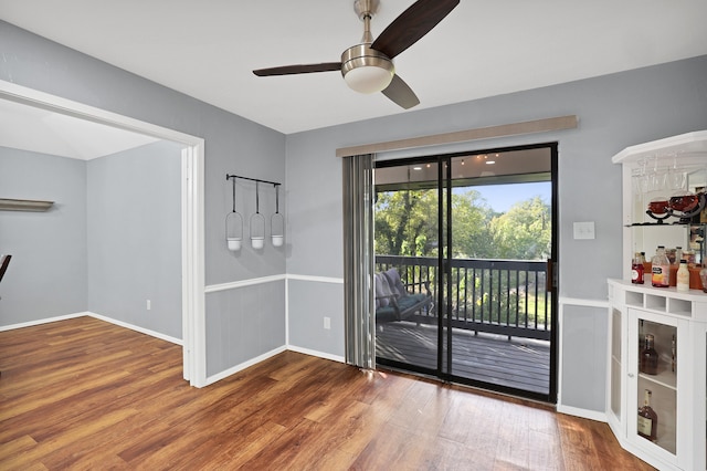 interior space with ceiling fan and hardwood / wood-style flooring