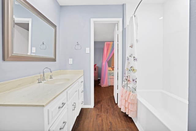 bathroom featuring vanity, shower / bath combo, and hardwood / wood-style flooring