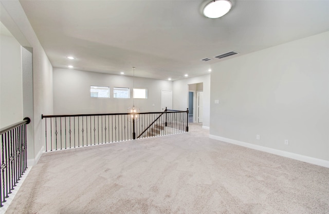 empty room with light colored carpet