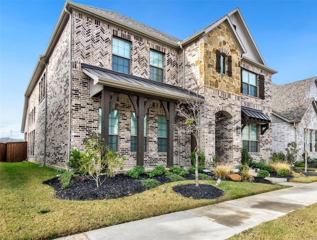 view of front of home with a front lawn