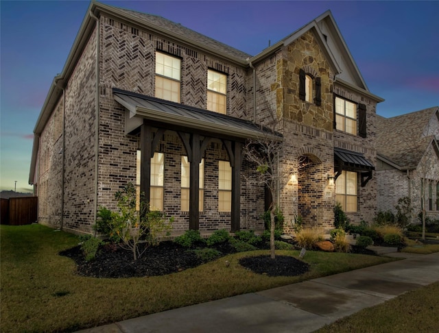 view of front of home with a yard