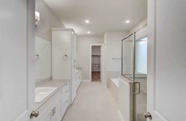 bathroom with independent shower and bath and vanity