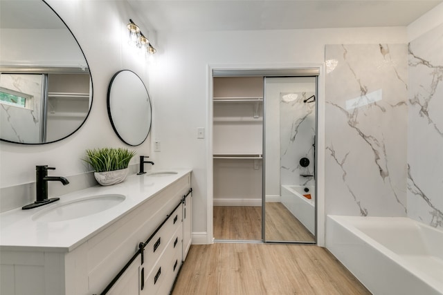 bathroom with vanity and hardwood / wood-style floors