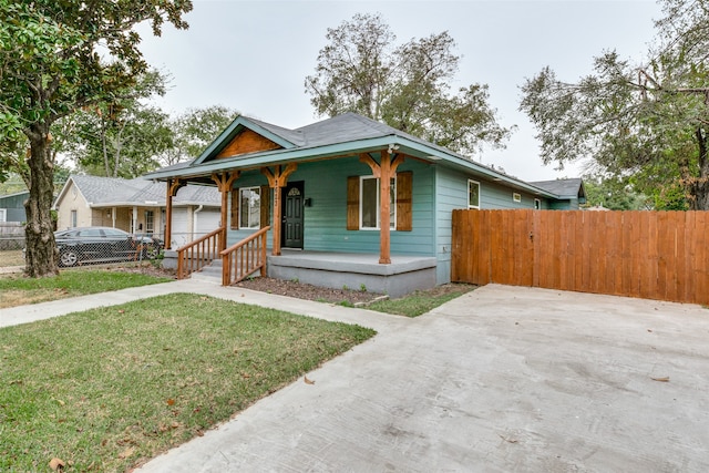 view of front of house featuring a front yard and a porch