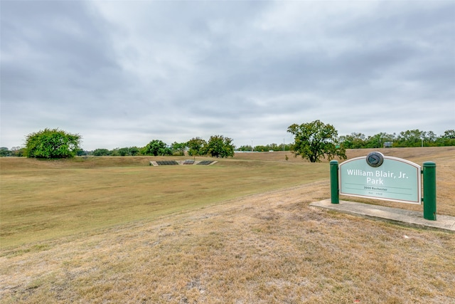 view of property's community with a lawn