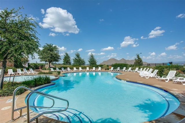 view of swimming pool featuring a patio area