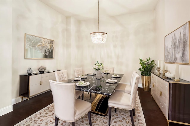 dining space featuring an inviting chandelier and dark wood-type flooring