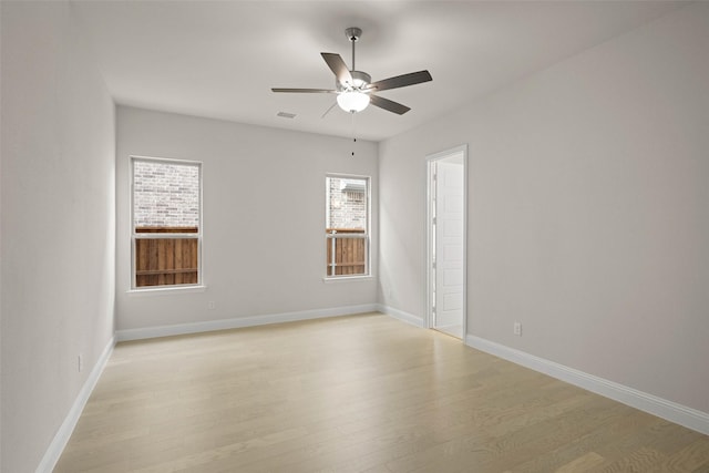 empty room with light hardwood / wood-style floors and ceiling fan