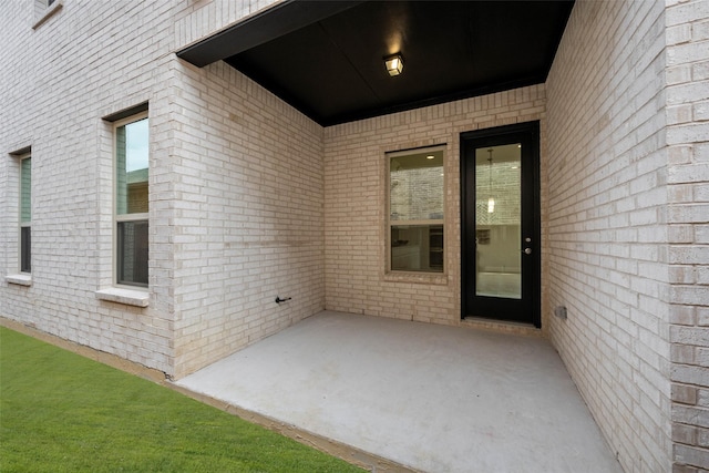 doorway to property with a patio area