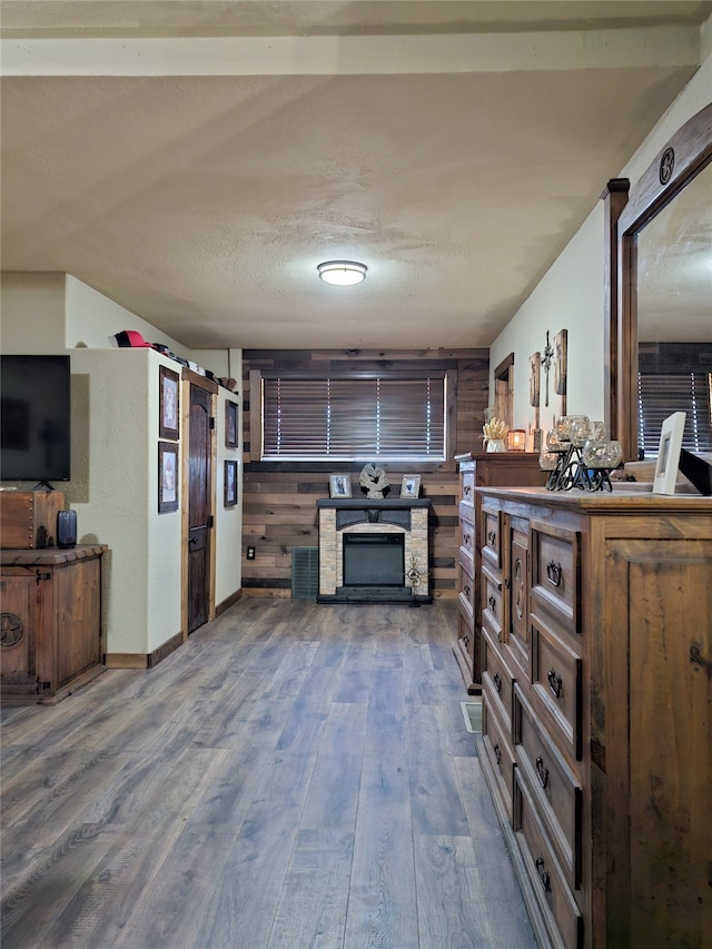 kitchen featuring wood walls and wood-type flooring