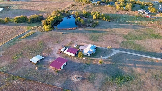 drone / aerial view with a water view and a rural view