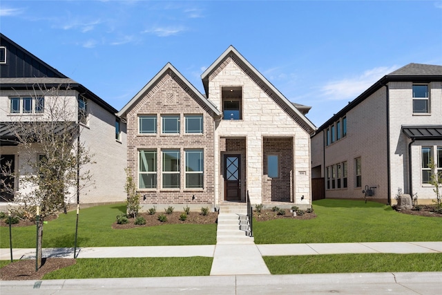 view of front of house with stone siding, a front lawn, and brick siding