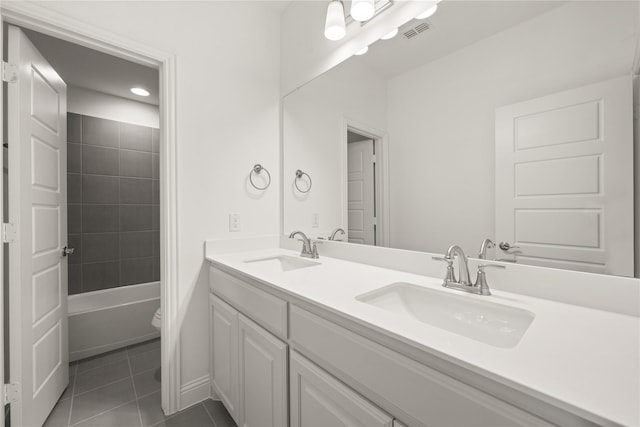 full bath featuring toilet, tile patterned flooring, visible vents, and a sink