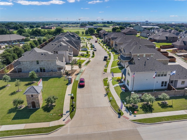 birds eye view of property with a residential view