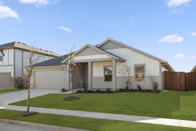 view of front of home featuring a garage and a front lawn