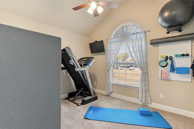 exercise room with carpet, vaulted ceiling, and ceiling fan