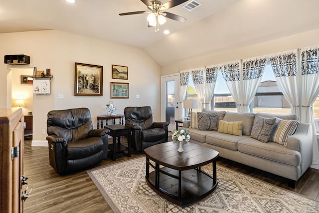 living room featuring visible vents, dark wood finished floors, baseboards, lofted ceiling, and ceiling fan