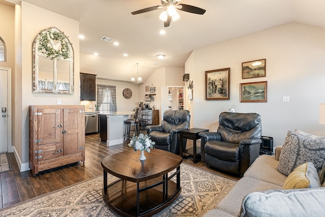 living room with vaulted ceiling, dark wood finished floors, visible vents, and a ceiling fan