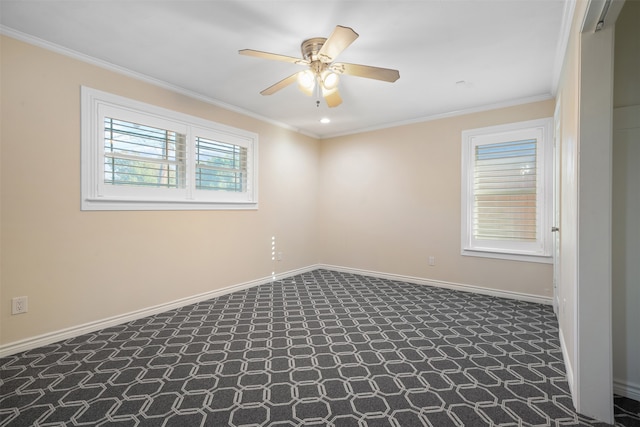 carpeted spare room with crown molding and ceiling fan