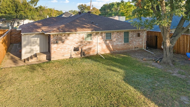 back of property featuring a lawn