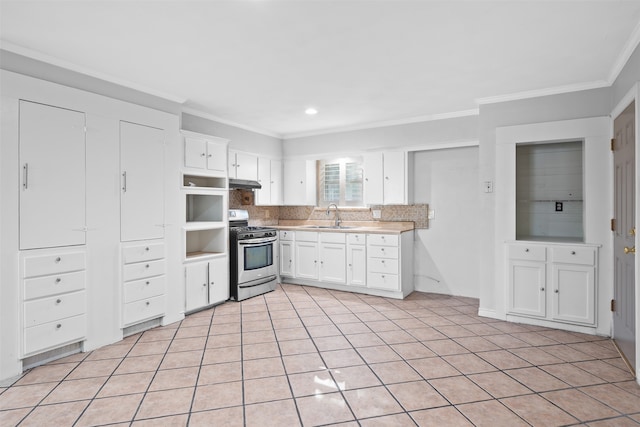 kitchen with sink, white cabinetry, crown molding, stainless steel range with gas cooktop, and backsplash