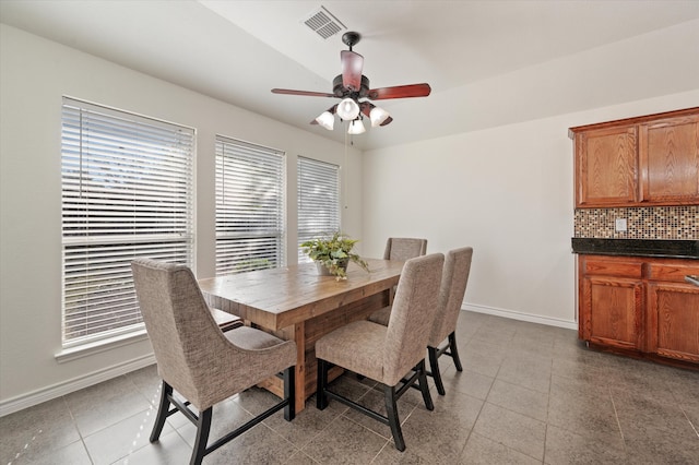 tiled dining room featuring ceiling fan