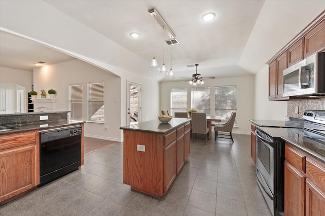 kitchen featuring ceiling fan, electric stove, pendant lighting, black dishwasher, and a kitchen island