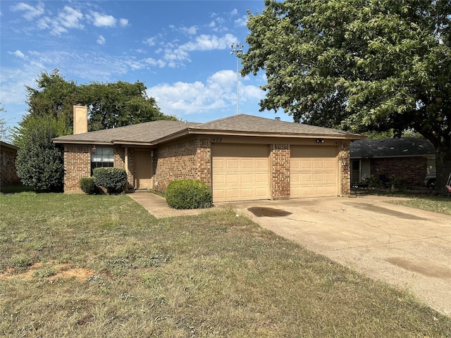 view of front facade with a front lawn and a garage