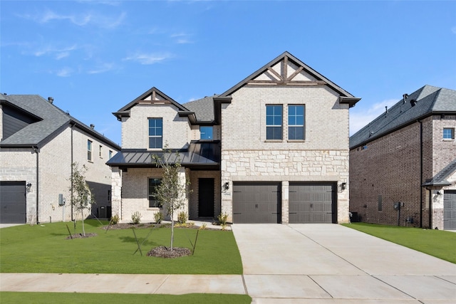 view of front of home with a front yard and a garage