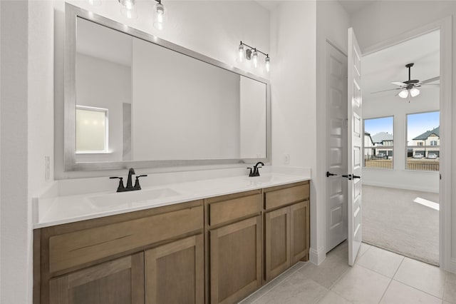 bathroom with ceiling fan, vanity, and tile patterned floors