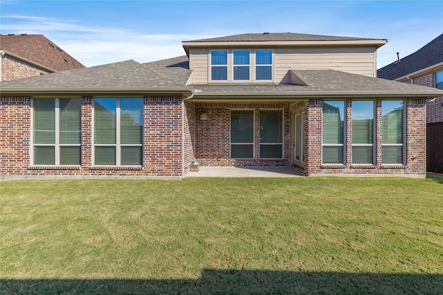 view of front facade featuring a patio and a front yard