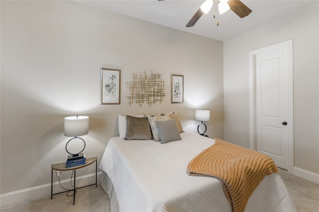 bedroom featuring ceiling fan and light carpet