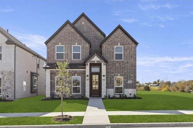 view of front of property featuring brick siding and a front lawn