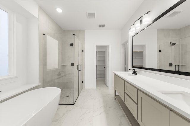 full bath featuring marble finish floor, visible vents, and a sink