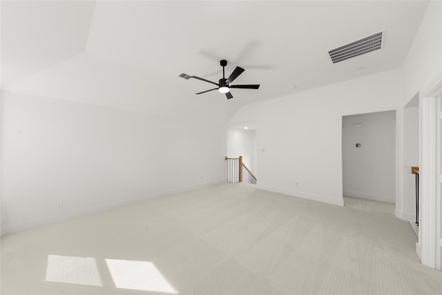 empty room featuring baseboards, visible vents, a ceiling fan, and light colored carpet