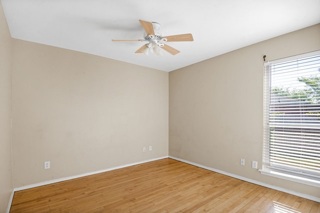 spare room featuring ceiling fan and light hardwood / wood-style flooring