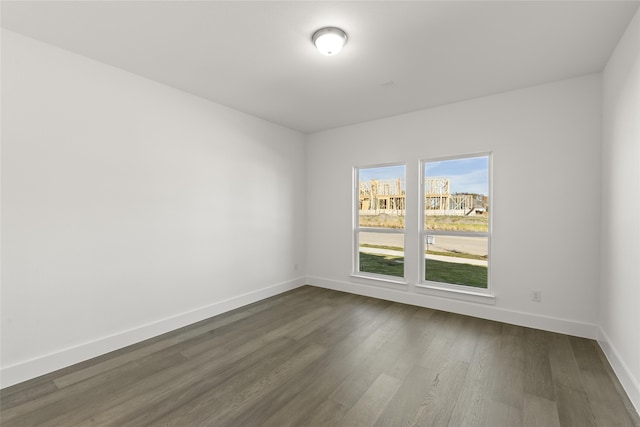 empty room featuring dark hardwood / wood-style flooring