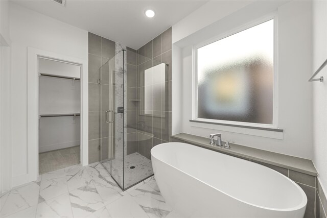 bathroom with independent shower and bath