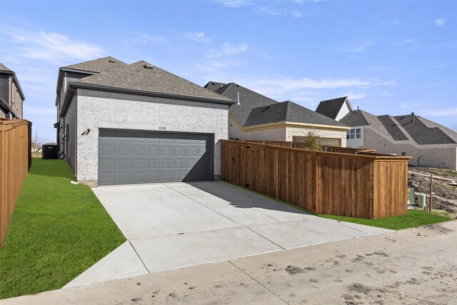 exterior space featuring cooling unit and a garage