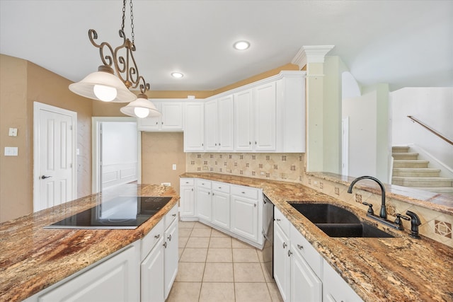 kitchen featuring white cabinets, tasteful backsplash, hanging light fixtures, dishwasher, and black electric stovetop