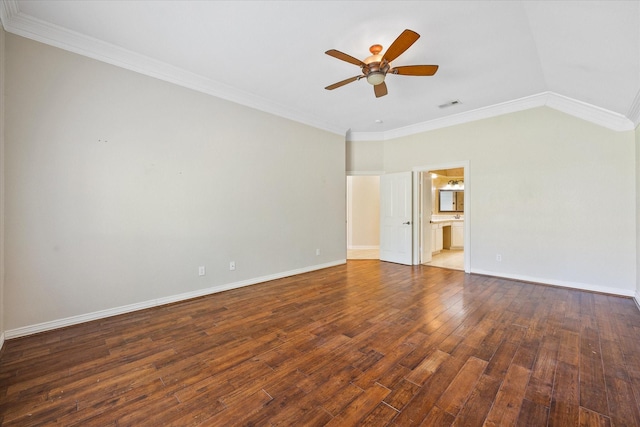 empty room featuring crown molding, a ceiling fan, visible vents, and wood finished floors