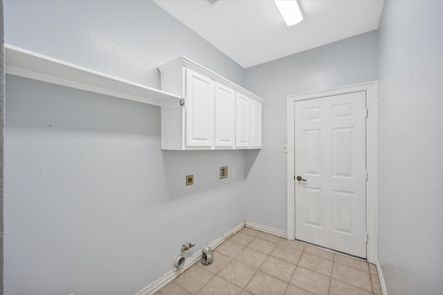 clothes washing area featuring gas dryer hookup, electric dryer hookup, light tile patterned floors, baseboards, and hookup for a washing machine