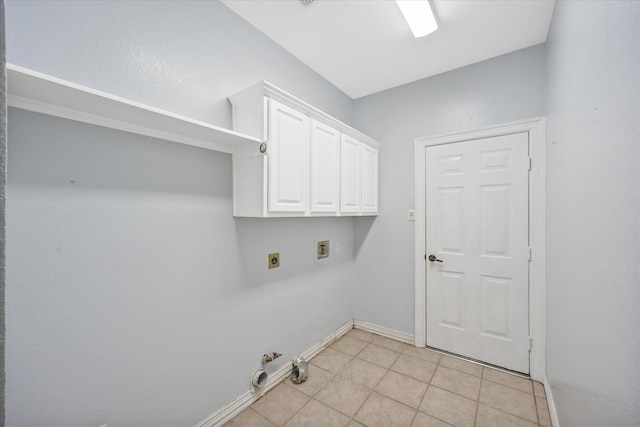 laundry room with hookup for a washing machine, electric dryer hookup, cabinets, and light tile patterned floors