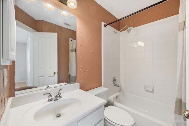 bathroom featuring visible vents, shower / bath combo with shower curtain, a textured wall, vanity, and toilet