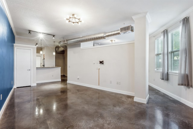 interior space featuring crown molding and a textured ceiling