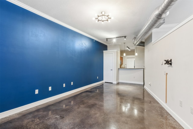 interior space featuring crown molding and a textured ceiling