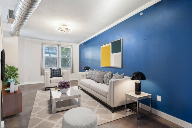 living room featuring ornamental molding, concrete flooring, and a textured ceiling